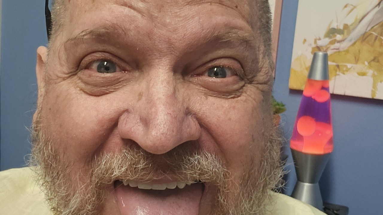 Dr. Partridge, July 21, 2025 - Writing about comedy in learning in my office.